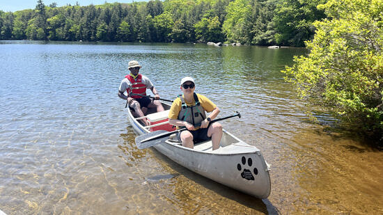 Two men canoeing in a lake (Photo © Karen Seaver)