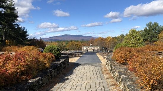 Mt. Monadnock and a granite memorial in autumn (Photo © Cathedral of the Pines)